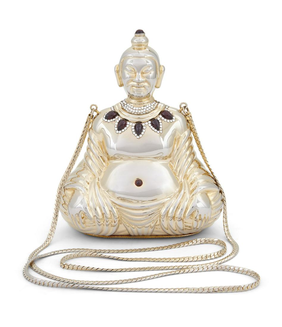 Judith Leiber "Buddha" Minaudiere: Judith Leiber "Buddha" Minaudiere 1987, with drop-in chain, the gilt-metal figure with a necklace of silver crystals and cabochon garnets, a cabochon garnet belly button and a garnet-topped push closu
