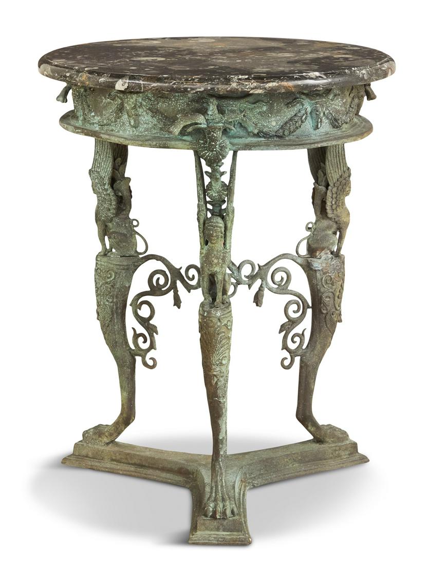 Bronze and Marble Table in the Etruscan Taste: Bronze and Marble Table in the Etruscan Taste 20th century, the later circular, fossilized black and white marble top resting on a conforming skirt decorated with ram's heads supporting swags of leave