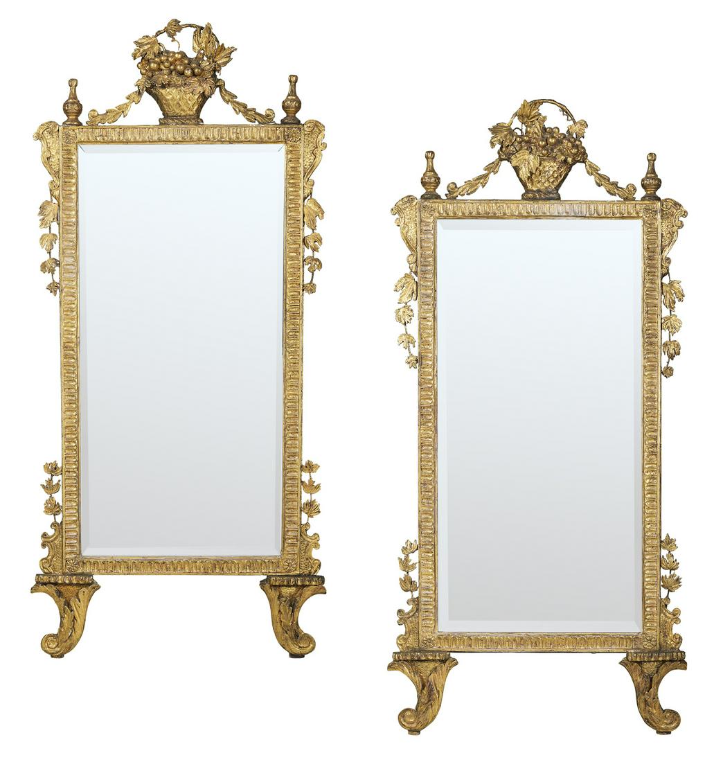 Pair of Italian Giltwood Mirrors: Pair of Italian Giltwood Mirrors 20th century, in the neoclassical Florentine taste, set on scrolled rests, the fluted surrounds mounted with giltwood and wire vines on each side, the crest comprised 