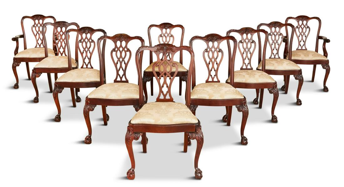 Ten George III-Style Mahogany Dining Chairs: Suite of Ten George III-Style Mahogany Dining Chairs comprised of two armchairs and eight side chairs, each with a domed, foliate-carved crest over a pierced and interlacing splat, the shaped and padd
