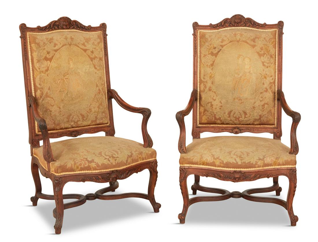 Pair of Louis XIV-Style Fauteuils a la Reine: Pair of Louis XIV-Style Fruitwood Fauteuils a la Reine 20th century, each with a tall, padded back surmounted by a foliate shield crest, joined by downswept arms to the padded seat, raised above a fol
