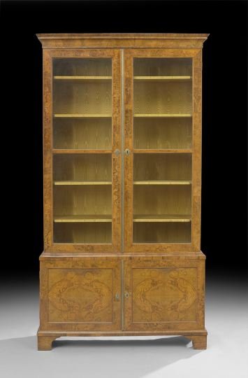 George III Walnut Bookcase: George III Walnut and Circassian Burl Walnut Bookcase, early 19th century and later, the molded cornice above a case fitted with two long doors, each bisected and inset with two glazed panels, the low