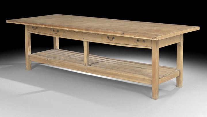 Large Provincial Pine Farmhouse Table: Large Provincial Pine Farmhouse Table, early 20th century, the rectangular top above a frieze fitted with two side drawers, joined to a slatted stretcher shelf by square legs, h. 32", d. 43", l. 105".