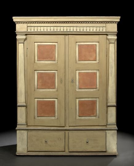 Northern European Polychromed Armoire: Northern European Polychromed Armoire, second quarter 19th century, the molded and dentillated cornice above a baluster-carved frieze, over two tri-paneled doors flanked to either side by engaged upri