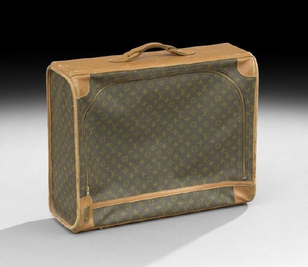 Louis Vuitton, Paris, Softside Suitcase: Louis Vuitton, Paris, Monogram Canvas and Tan Leather Softside Suitcase, with a full zippered opening at one side, the chocolate brown cotton-lined interior with two elasticized snap pouches at the si