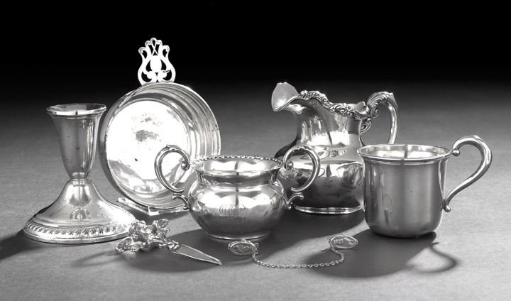 Seven Pieces of American Small Silverware: Seven Pieces of Miscellanous American Small Silverware, first half 20th century, including a Gorham cream pitcher, date mark 1906, h. 4-1/4", a Mueck-Cary christening mug dated 1946, h. 2-3/4", a Webs