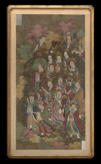 Tall Chinese Buddhistic Painting on Silk: Tall Chinese Buddhistic Painting on Silk, 19th century, executed in colors on silk depicting the haloed goddess Guanyin attended by twenty-four Buddhist deities including emperors, demons and attendan