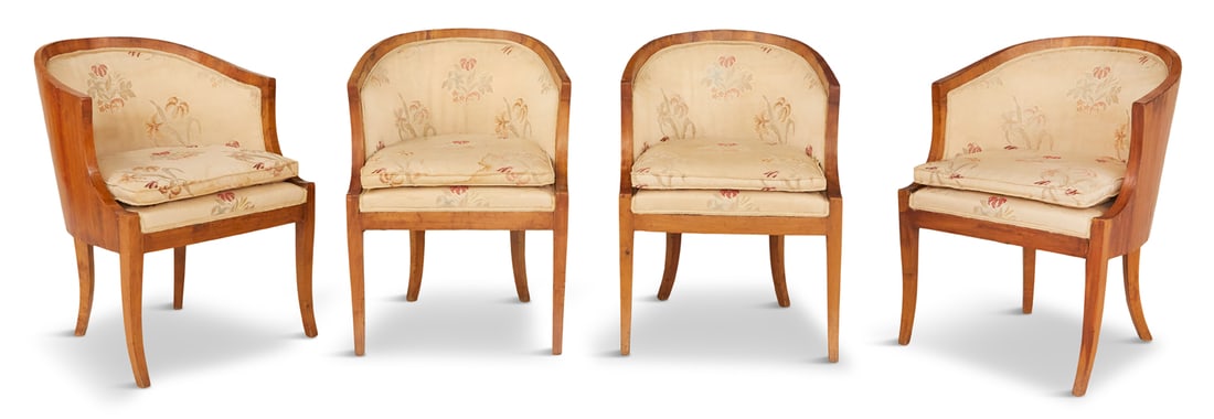 Suite of Four Biedermeier Fruitwood Tub Chairs: Suite of Four Biedermeier Fruitwood Tub Chairs mid-19th century, each with a downswept, rounded crest above the padded back and sides, the cushioned seat raised on sabre legs. h. 30", w. 22", d. 20" P