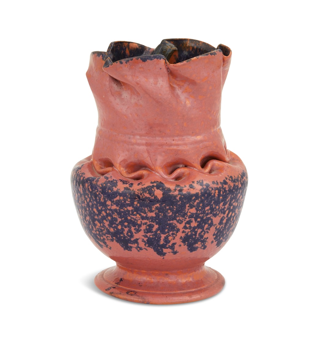 George E. Ohr Footed Vase: George E. Ohr Footed Vase ca. 1900, American, with ruffled rim and in-body twist, the dappled raspberry glaze with sponged-on indigo and ochre-glazed interior, with impressed "G. E. Ohr/Biloxi, Miss"