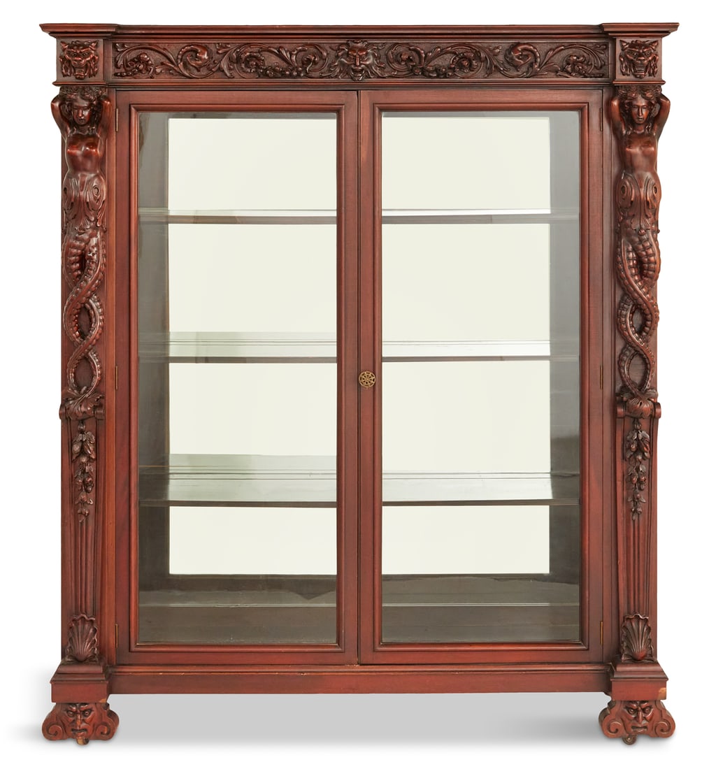 American Neo-Renaissance Bookcase/Vitrine: American Neo-Renaissance Mahogany Bookcase/Vitrine fourth quarter 19th century, attributed to R. J. Horner, New York, the front with a heavily carved frieze above a pair of doors flanked by figural "t