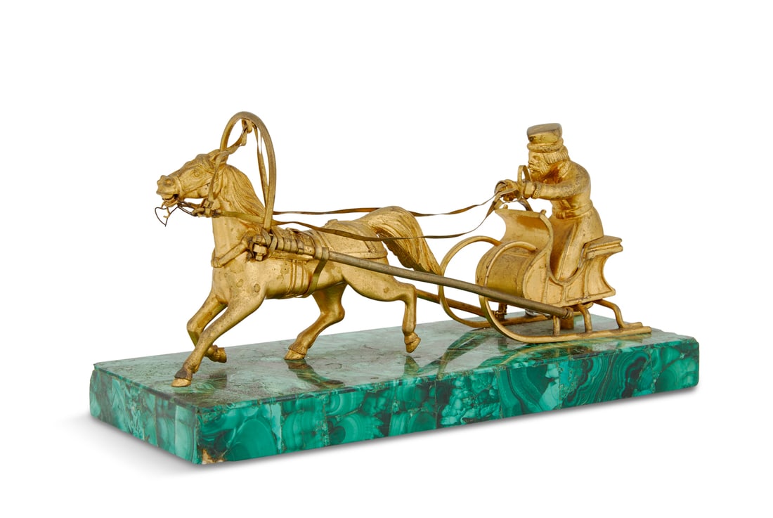 Malachite Figure of a Horse-Drawn Sleigh: Gilt-Bronze, Brass and Malachite Figure of a Horse-Drawn Sleigh ca. 1900, Russian, the figure in Russian costume, seated in a horse-drawn sleigh, mounted on a malachite-clad plinth. h. 3-3/4", w. 7",