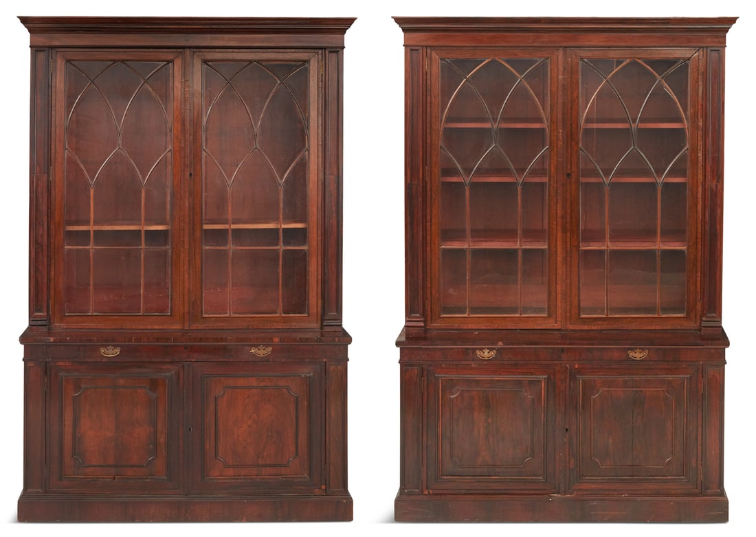 Pair of Regency Rosewood Bookcases: Pair of Regency Rosewood Bookcases second quarter 19th century, each with a molded, rectangular cornice above two astragal-glazed doors, flanked to either side by paneled uprights, the lower section f