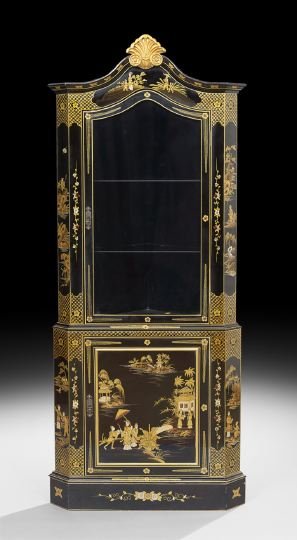 Ebonized and Polychrome Corner Cabinet: Contemporary Ebonized and Polychrome Corner Cabinet, in the Georgian Style, the molded and domed cornice centered by a carved shell crest, above a glazed door, with a single paneled cupboard below fea