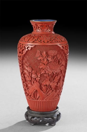 Chinese Cinnabar Vase on Stand: Chinese Cinnabar Vase on Stand, 20th century, with floral reserves with stylized lotus scroll borders, fitted stand, h. 7", without stand.