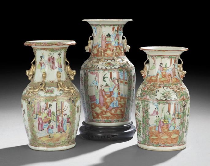 Three Chinese Export Rose Medallion Vases: Three Chinese Export Porcelain Rose Medallion Vases, all of baluster form, the largest with gilt foo dog handles and gilt lizards applied to the shoulders, decorated with gilt highlights in the female