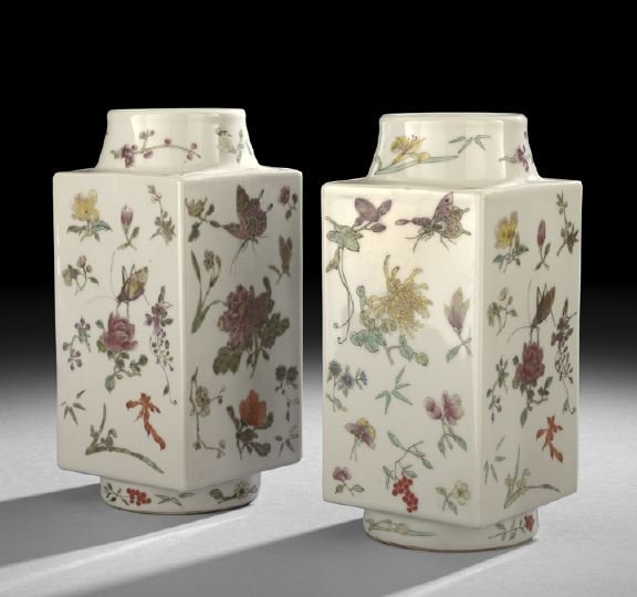Pair of Chinese Famille Rose Porcelain Vases: Pair of Chinese Famille Rose Porcelain Vases, 20th century, each of squared rectangular form with rounded necks, decorated all over with flowers and insects against a white ground, h. 9-1/2".
