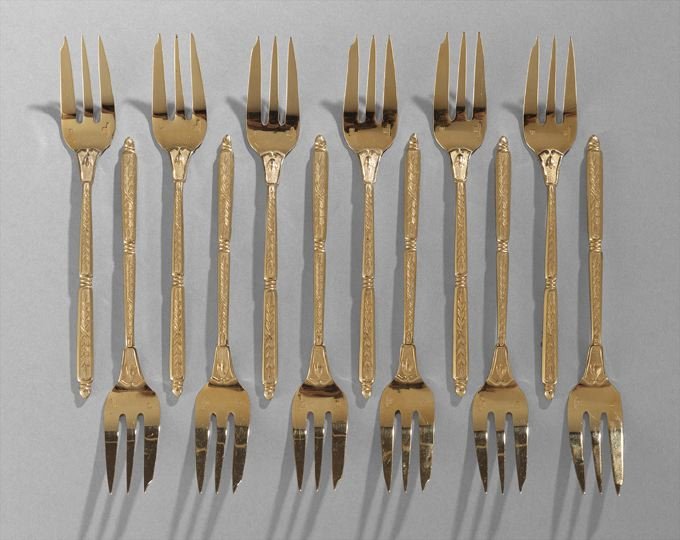 12 Christofle/Alfinide Gilt Metal Dessert Forks: Cased Set of Twelve Christofle/Alfinide Gilt Metal Dessert Forks, third quarter 20th century, Paris, each with three tines, the handle of square section "a la Russe", with laurel-and-ribbon decoration