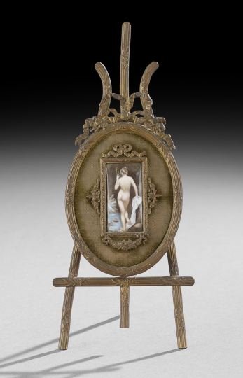 French Enamel Plaque of the Bathing Venus: Diminutive French Framed Enamel Plaque of the Bathing Venus Holding a Mirror, first quarter 20th century, probably Limoges, presented in the original laurel leaf-bound reeded and bow-embellished Louis