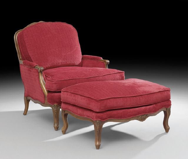 Provincial Louis XV-Style Fruitwood Bergere: Provincial Louis XV-Style Fruitwood Bergere, the slightly domed back surmounted by a foliate crest, cushioned and joined to the like seat by scrolling arms, raised on cabriole legs ending in scrolled 