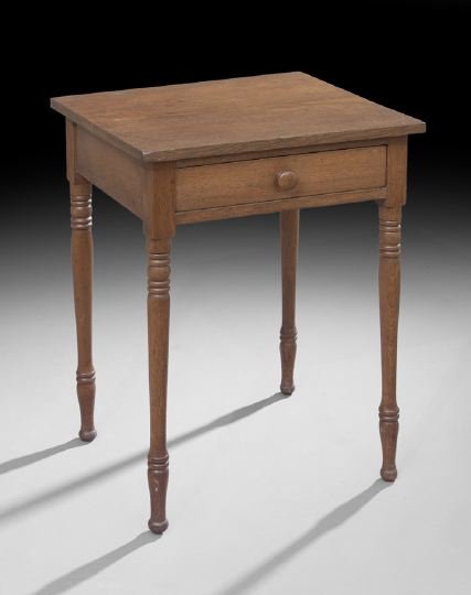 Vernacular American Sheraton Walnut Stand: Vernacular American Sheraton Walnut Stand, second quarter 19th century, with a projecting two-board top, single drawer and turned legs, h. 28-3/4", w. 21-1/8", d. 19-1/2".