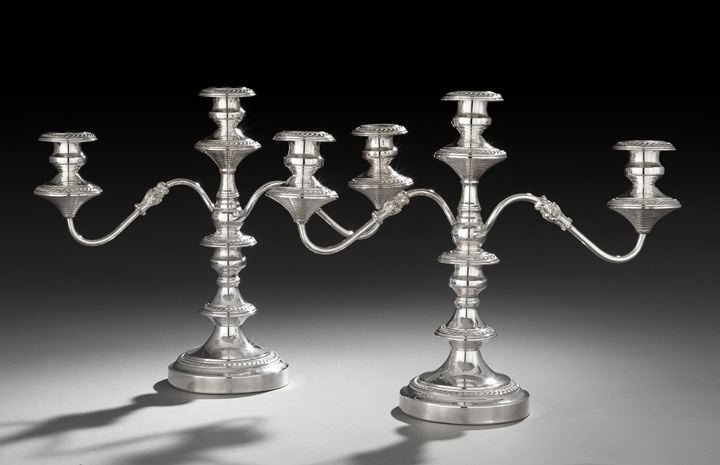 Pair of American Silverplate Candelabra: Pair of American Silverplate Candelabra, third quarter 20th century, by the Goldfelder Silverware Co., Yalesville, Connecticut, each with a knopped baluster standard above a cavetto domed circular foo