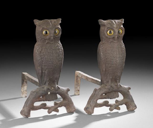 Pair of American Cast-Iron "Owl" Andirons: Pair of American Cast-Iron "Owl" Andirons, early 20th century, the owls each perched on a gnarled limb, stamped: "3000-2" on the hollow reverse, both pair of glass eyes set in with a metal strap, the