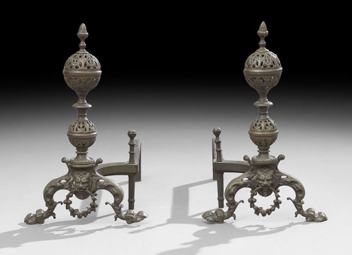 Pair of Brass and Cast-Iron Andirons: Pair of Brass and Cast-Iron Andirons in the Renaissance-Style, ca. 1900, probably New England, the andirons with cabriole legs ending in paw feet, and with a satyr mask gripping a ring pull, the upper