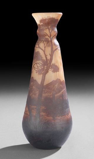 Richard Cameo Glass Vase, Loetz Factory: Richard Cameo Glass Landscape Vase, Loetz Factory, first quarter 20th century, the vase in a mottled clear and orange glass overlaid with dark amber and purple, cut in patterns of chalets on a lake ag