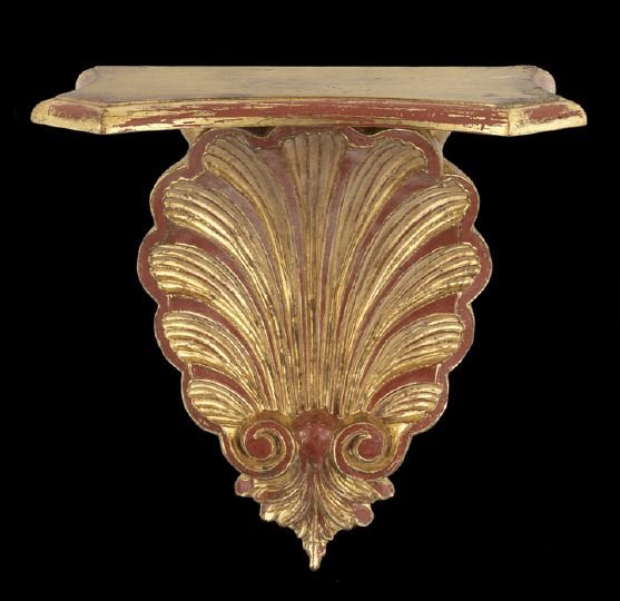 Classical Revival Italian Bracket: Classical Revival Italian Bracket, comprised of wood and composition, the shaped shelf supported by a gilded shell in an antique finish, h. 14-3/4", w. 13-1/2", d. 7".