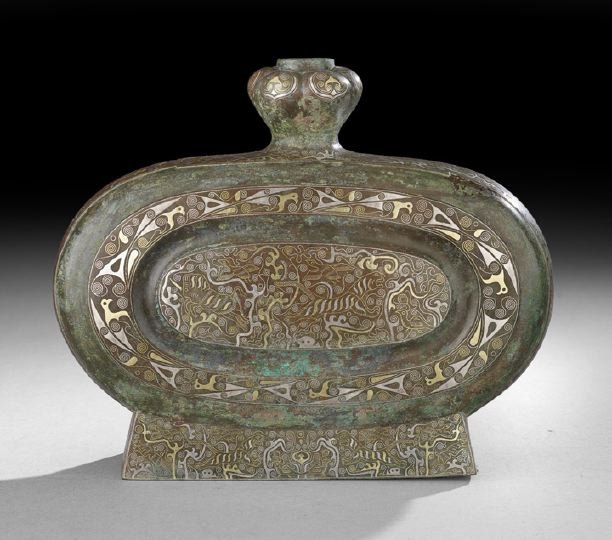 Western Han Dynasty Bronze Bianhu Flask: Western Han Dynasty Bronze Bianhu Flask, (206 BC - 900 AD), the flattened body with shaped edges and raised on a quadrangular foot, surmounted by a cylindrical neck with a lobed, onion bulb mouth, emb