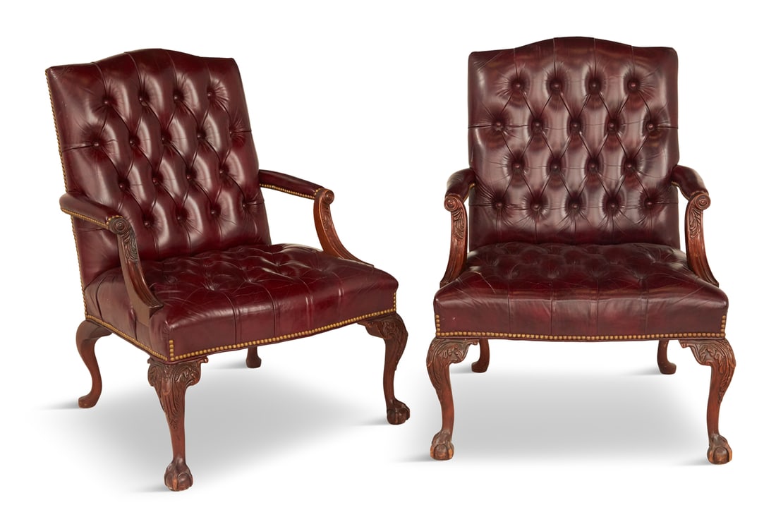 Pair of George III-Style Gainsborough Chairs: Pair of George III-Style Mahogany Gainsborough Chairs 20th century, each with a slightly domed and tufted back joined by padded, foliate-carved arms to the padded and tufted seat, raised on cabriole l