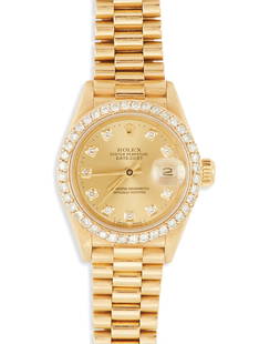 Lady's Diamond Rolex Oyster Perpetual Watch: Lady's Diamond Rolex Oyster Perpetual Datejust Watch 18k yellow gold, the champagne dial with diamond markers, stamped "Rolex Oyster Perpetual Datejust Superlative Chronometer Officially Certified