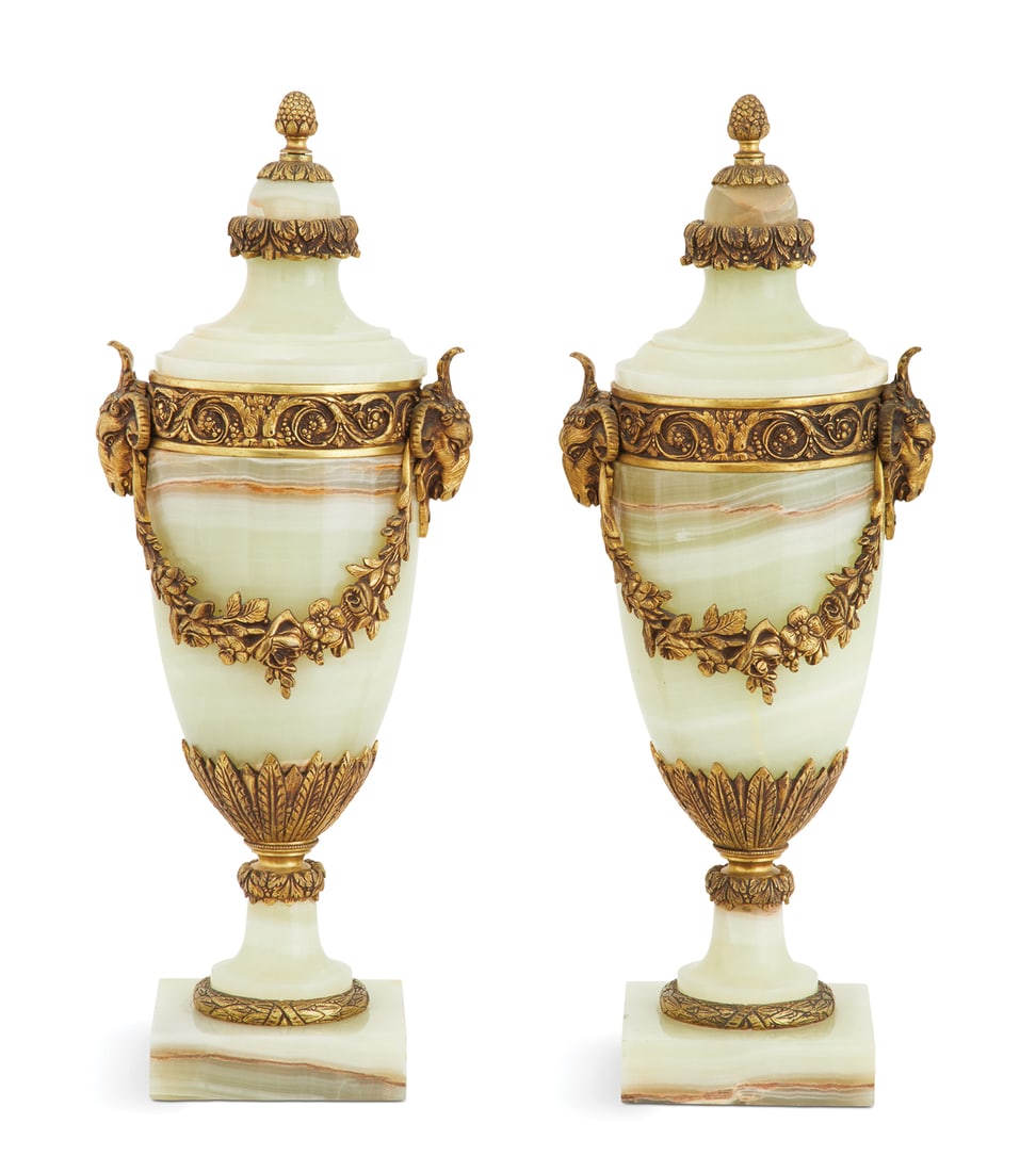 Pair of French Bronze-Mounted Onyx Garniture Urns: Pair of French Bronze-Mounted Onyx Garniture Urns first quarter 20th century, each having an ogee cover with a cone-form knop and leaf-molded trim, the body with ram''s-head handles supporting swags o