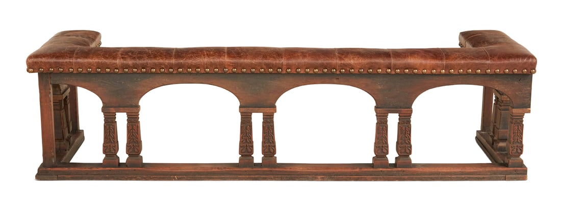 Unusual Carved Wood and Faux Leather Club Fender: Unusual Carved Wood and Faux Leather Club Fender second quarter 19th century, the faux leather cushioned seat secured with brass nailheads, above arched rails supported by tapered leaf-carved baluster