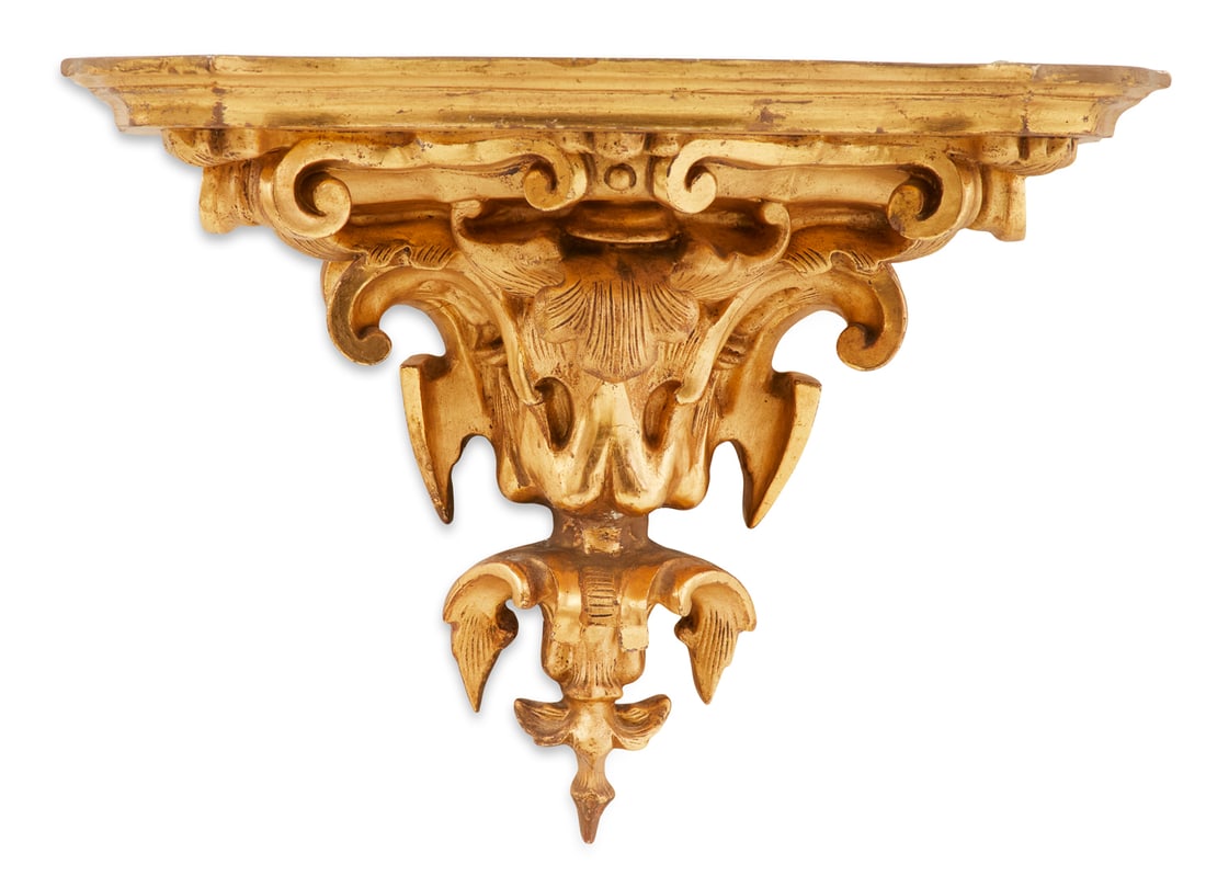 Giltwood Bracket in the Rococo Taste: Giltwood Bracket in the Rococo Tastethird quarter 19th century, the shelf with molded serpentine edges, on a vasiform support carved with leaves and scrollwork, retaining a surface of matte gilt and c