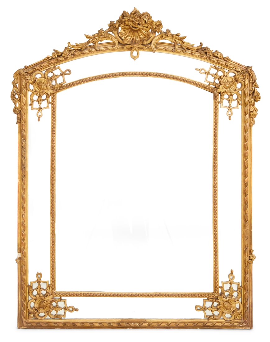 Giltwood Arched Overmantel Mirror: French Giltwood Arched Overmantel Mirror fourth quarter 19th century, in the rococo taste, the pierced crest decorated with a central shell and scrollwork accented with trailing flowers, the outer sur