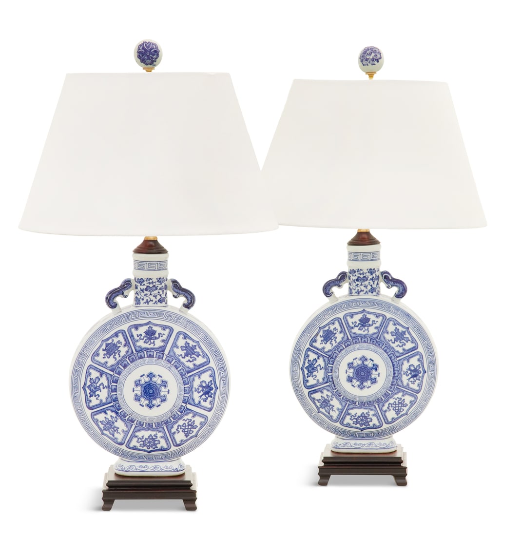 Pair of Blue and White Moon Flasks: Pair of Chinese Export Blue and White Moon Flasksnow mounted as lamps, decorated with peonies and vases, raised on hardwood bases and mounted with shades.h. 28-1/2", dia. 16"