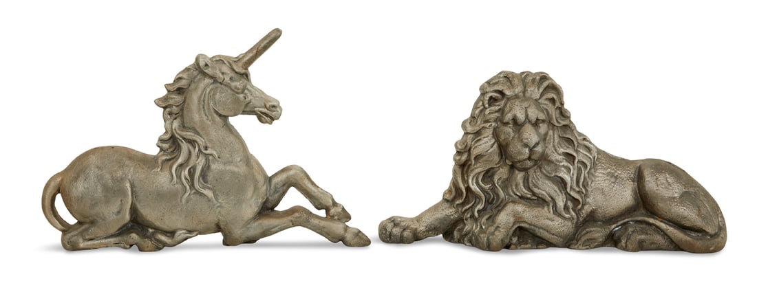 "Lion and Unicorn" Cast Iron Andirons: Pair of "Lion and Unicorn" Cast Iron Andirons20th century, based on the English royal coat of arms, the metal billet bars in the rear.h. 13" and 16-1/2", w. 28-1/2", d. 13"
