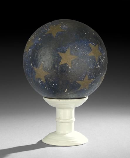Plaster Painted Orb on Stand: Plaster Painted Orb on Stand, the orb painted with gold stars on a blue ground, and resting on a Victorian ironstone scale stand, signed "Herbert Brothers Weighing Machines, London", in black transfer