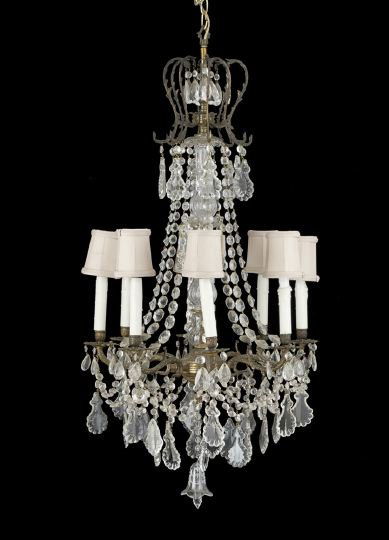 Louis XVI-Style Bronze and Crystal Chandelier: Louis XVI-Style Eight-Light Bronze and Crystal Chandelier, the foliate decorated bronze core with a bell-shaped crystal finial, mounted with scrolled candle arms, cups and drip pans fitted with faux c