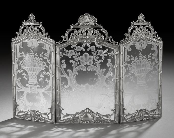 Continental Silver and Glass Table Screen: Continental Silver and Glass Table Screen, first quarter 20th century, probably Wolf & Knell, Hanau, of triptych form, each panel of cenotaph form, with a silver reed-and-ribbon banded frame with open