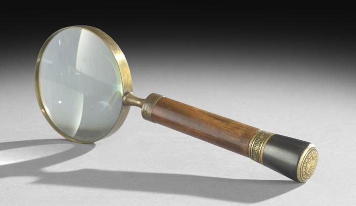 Gilt-Bronze, Ebony and Fruitwood Magnifying Glass: Gilt-Bronze, Ebony and Fruitwood Magnifying Glass, ca. 1900, the round fruitwood handle with an ebonized end, bordered with ebony and gilt-bronze vines on the side, and decorated with a dragon on a fi