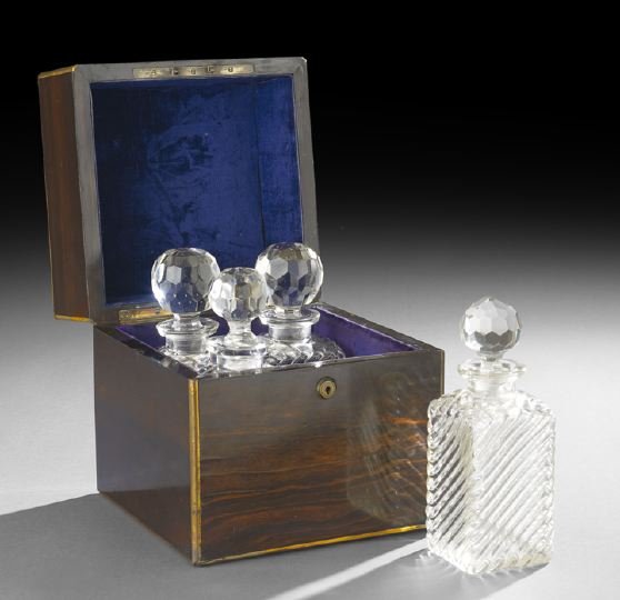 English Victorian Brass-Bound Decanter Box: English Victorian Brass-Bound Decanter Box, mid-19th century, the calamander wood box, fitted with a signed Bramah cylinder lock, with a rectangular brass cover escutcheon and purple velvet lining, an