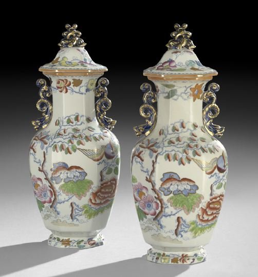 Pair of Mason's Ironstone Covered Garniture Vases: Pair of Mason's Ironstone Covered Garniture Vases, ca. 1900, Flying Bird Pattern, the faceted vases decorated in the Imari palette with phoenix birds, chrysanthemums and plum trees printed in blue and
