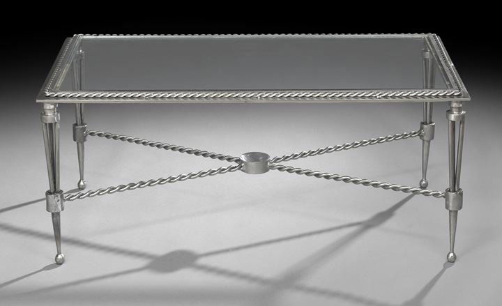 Steel and Glass Coffee Table: Forged and Hand-Wrought Steel and Glass Coffee Table, 1995, the rectangular top with inset glass and raised on tapering tubular legs ending in ball feet, the top edge and x-stretchers in a rope twist