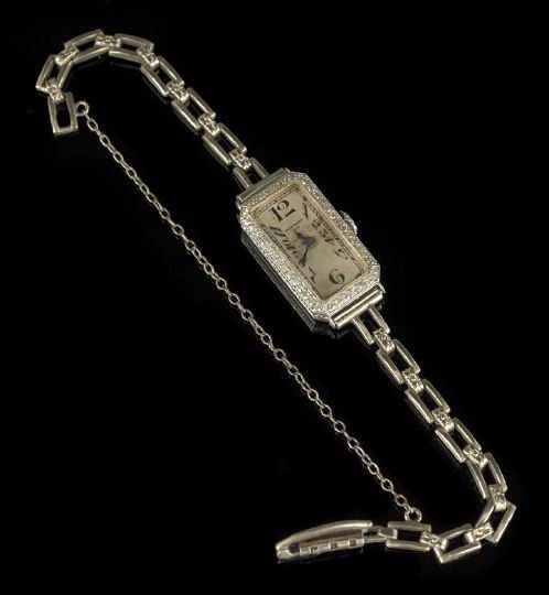 Lady's Platinum Patek Philippe Wrist Watch: Lady's Platinum and Diamond Patek Philippe and Company Wrist Watch, with eighteen jewels, eight adjustment rectangle movement in a hinged unmarked platinum case set with forty-two single-cut diamonds