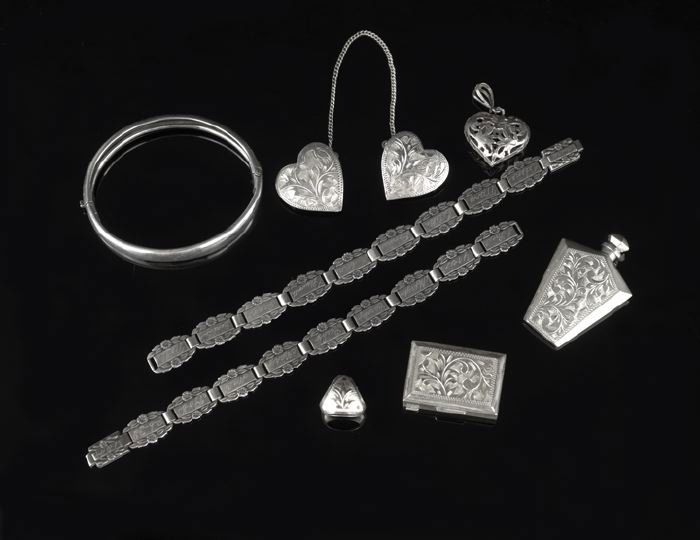 Eight Pieces of Vintage Sterling Silver Jewelry: Eight Pieces of Vintage Anglo-American Sterling Silver Jewelry, first half, 20th century, including a pair of "forget-me-not" link bracelets, l. 6-1/2", an Edwardian hinged bangle bracelet, hallmarked