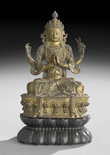 Chinese Gilt-Bronze Image: Chinese Gilt-Bronze Image, Ch'ien Lung reign (1735-1796) and of the period, the seated figure of the Buddhist divinity Shadakshari-Lokeshvara in princely jewels on a double lotus throne, rubbing to gi