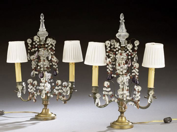Pair of Louis XVI-Style Two-Light Candelabra: Pair of Louis XVI-Style Two-Light Candelabra, now mounted as lamps, the round bases decorated with beaded scrolled arms holding beaded drip pans and candle cups, the central standard sheathed with gla