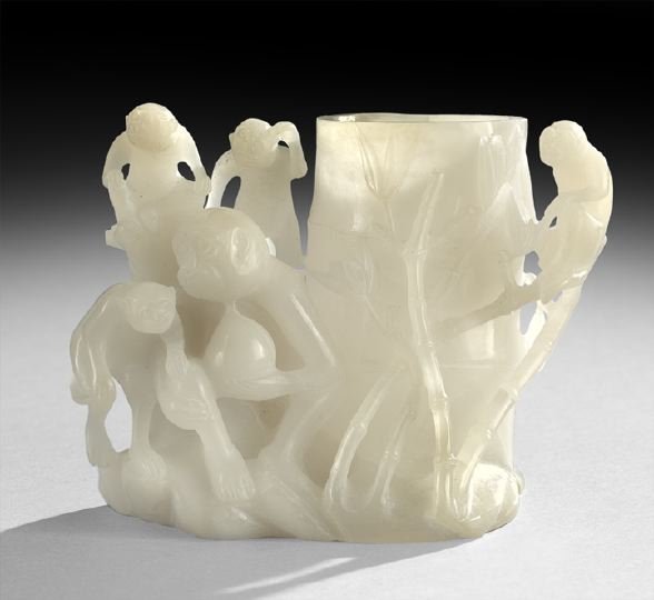 Chinese Hardstone Vase: Chinese Hardstone Vase, 20th century, the white-colored stone with a slight lavender tone, carved in the form of a group of monkeys and bamboo, h. 5-1/2", l. 6".